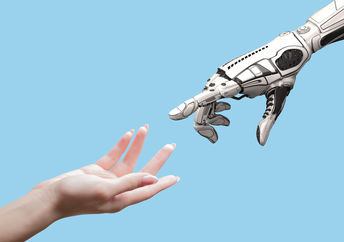 人类和机器人手象征着人和ai之间的联系